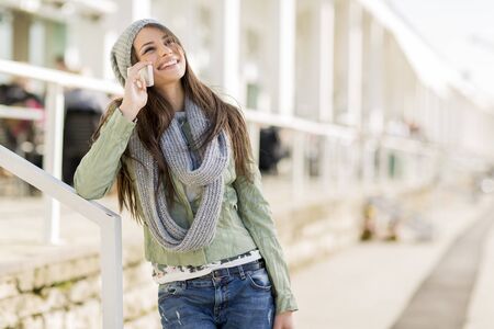 Young woman with mobile phoneの写真素材