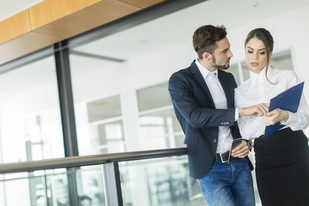 Young couple working in the officeの写真素材