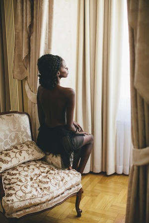 Young black woman in the roomの写真素材
