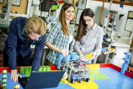 Young people in the robotics classroom Young people in the robotics classroom