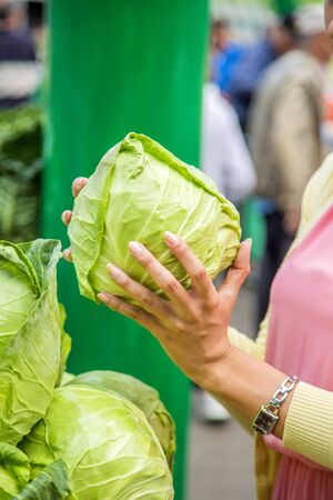Woman buying vegetables on the marketの写真素材