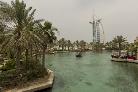 DUBAI, UAE - MAY 8, 2015: Unidentified people at Madinat Jumeirah in Dubai. Madinat Jumeirah encompasses two hotels and clusters of 29 traditional Arabic houses.のeditorial素材