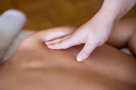 Young man having a massageの写真素材