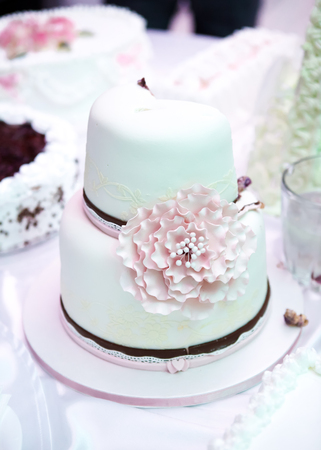 View at the white wedding cake