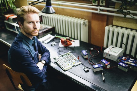 Young man in electronics workshop
