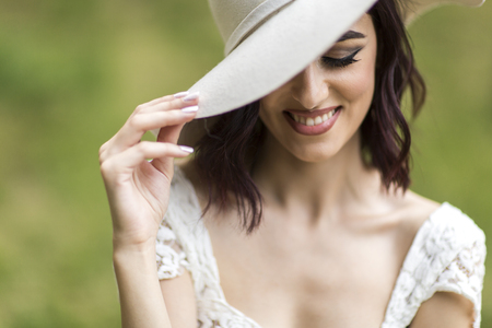 Young woman with a hat outdoorsの写真素材