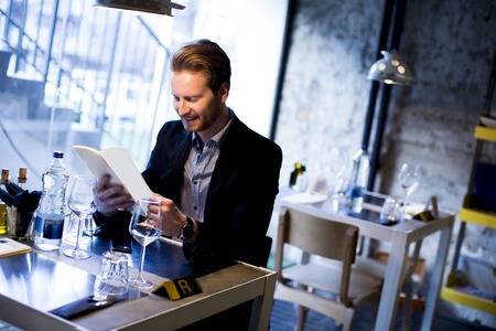 Young man in the restaurantの写真素材
