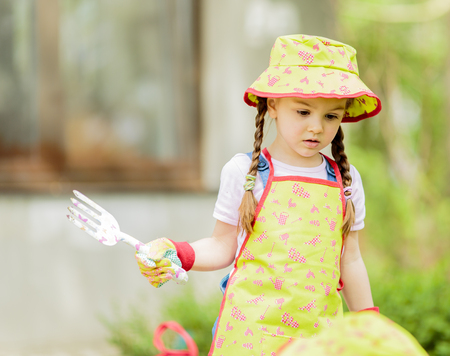 Little girl in the gardenの写真素材