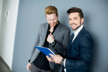 Young men standing in the office