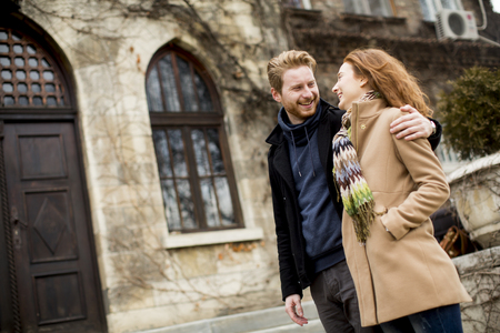 Young red hair couple at autumn parkの写真素材