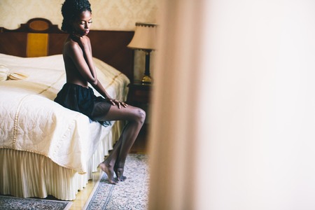 Young black woman in the roomの写真素材