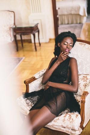 Young black woman in the roomの写真素材