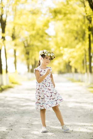 Little girl in the summer parkの写真素材