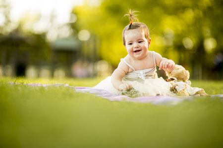 Baby girl in the grassの写真素材