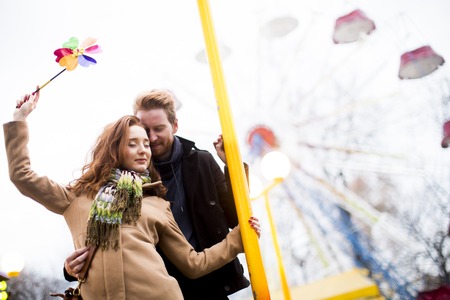 Young couple in the amusement parkの写真素材