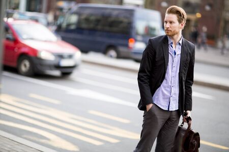 Young red hair man outdoorsの写真素材