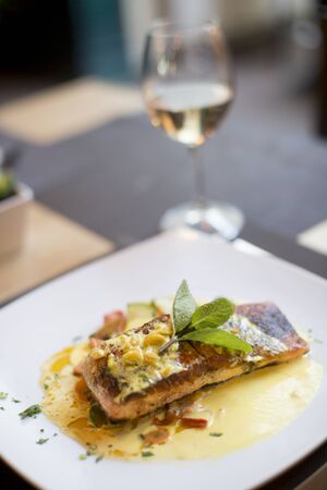 Grilled salmon with sauce and herbs