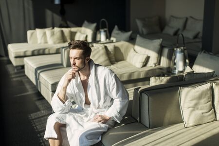 Young man in the room at morningの写真素材