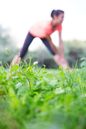 Young woman taking exercie in the parkの写真素材