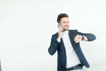 Young man with mobile phone in the office