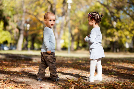 Kids in the autumn parkの写真素材