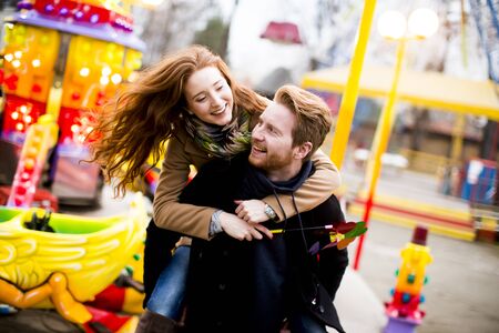 Young couple in the amusement parkの写真素材