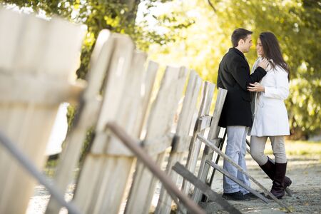 Young couple in the autumn parkの写真素材