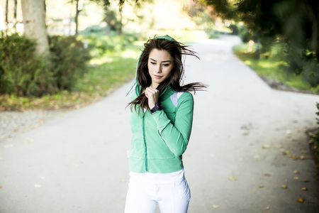 Young woman running in the parkの写真素材