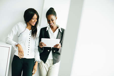 Young african women with tablet in the officeの写真素材