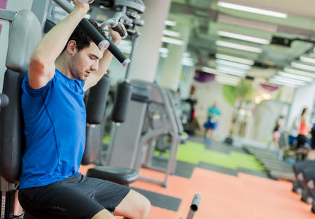 Young man training in the gym