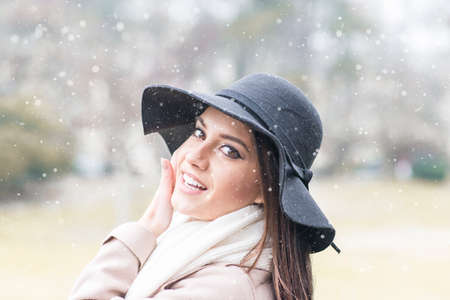 Pretty young woman with hat