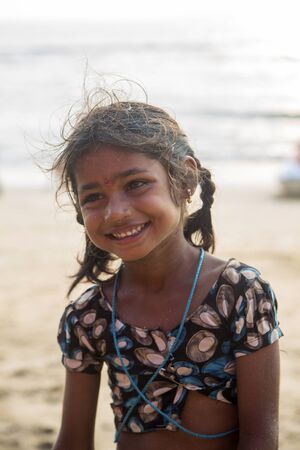 ANJUNA, INDIA - OCTOBER 14, 2015: Unidentified Goan Girl posing  at the Anjuna Beach.のeditorial素材