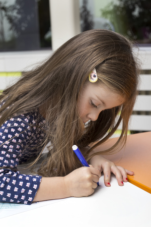 Little girl drawing at playroomの写真素材