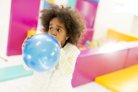Black little girl with a balloonの写真素材