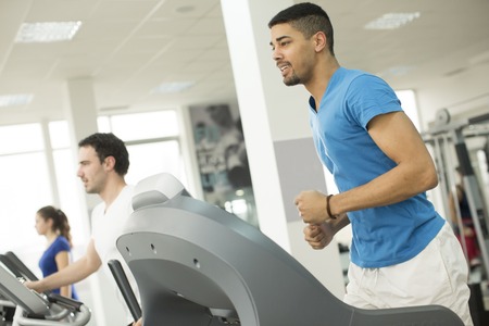 Young multiracial men in the gym