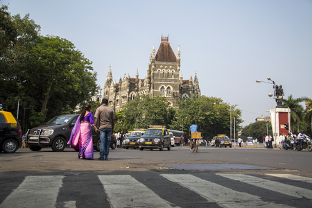 MUMBAI, INDIA - OCTOBER 9, 2015: Unidentified people by the Oriental buildings in Mumbai, India. Building  was built at 18850 and initially housed the Cathedral School.のeditorial素材