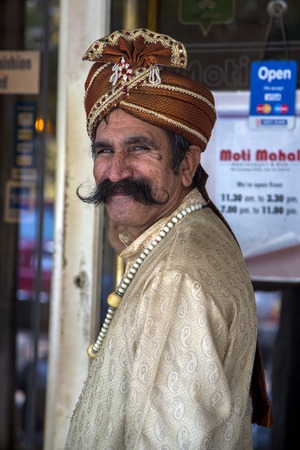 PANAJI, INDIA - OCTOBER 14, 2015: Unidentified doorman in traditional clothes at Panaji, Goa, Indiaのeditorial素材