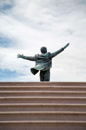 POLIGNANO, ITALY - APRIL 3, 2015: Domenico Modugno Statue in Polignano, Italy. Domenico Modugno is considered to be the first Italian cantautore.のeditorial素材