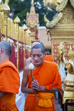CHIANG MAI, THAILAND - JANUARY 31, 2016:  Buddhist monks in the Wat Phra That Doi Suthep in Chiang Mai. It is a sacred site to many Thai people and it's famous for its white elephant shrine.のeditorial素材