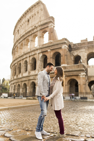 Loving couple in front of the Colosseum in Romeの写真素材