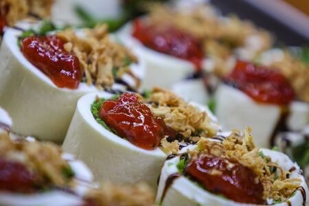 Closeup of the vegetarian rolls of mozzarella