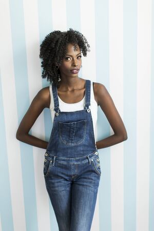 African american woman posing by the wallの写真素材