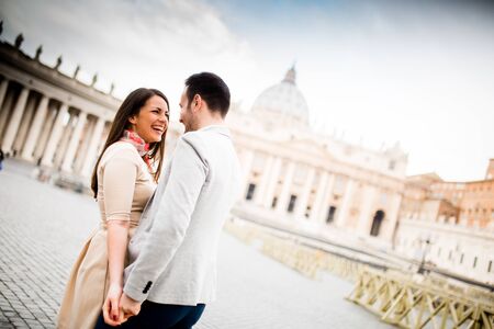 Loving couple at the St. Peter's Square in Vaticanの写真素材