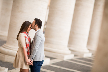 Loving couple at the St. Peter's Square in Vaticanの写真素材