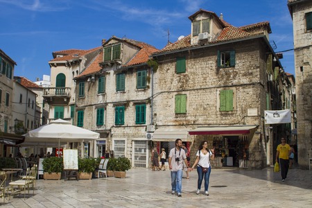 SPLIT, CROATIA - AUGUST 31, 2014: Tourists walking in the Old Town on a summer day. Split is popular touristic coastal destination in Croatia.のeditorial素材