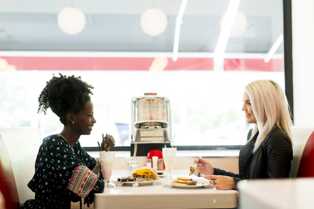 View of the women eating in the dinerの写真素材