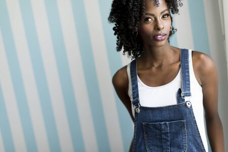 African american woman posing by the wallの写真素材