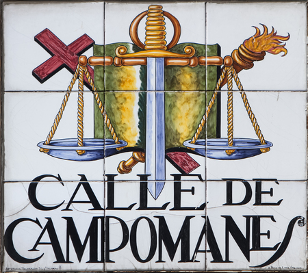 MADRID, SPAIN - MARCH 13, 2016: Closeup of the street sign in Madrid. They are hand-painted ceramic tiles typically composed within 9 or 12 tiles. They depict the name of the alley or street, as well as illustrations that indicate special meanings.のeditorial素材