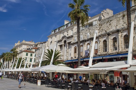 SPLIT, CROATIA - AUGUST 31, 2014: Tourists on the Riva (sea promenade) on a summer day. Split is popular touristic coastal destination in Croatia.のeditorial素材