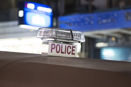 Closeup of the police sign on the car in Bangkokの写真素材